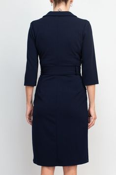 Be sure to make a sophisticated statement with this Sharagano dress. Crafted from stretch crepe, this piece boasts a notched collar, 3/4 sleeve design, and a matching belt to cinch you in. Style this timeless piece with silver jewelry and strappy heels for a refined and elegant look. Navy Long Sleeve Midi Dress For Formal Occasions, Formal Navy V-neck Midi Dress, Formal Midi Dress With 3/4 Sleeve, Semi-formal Fitted Midi Dress With 3/4 Sleeve, Formal Navy Midi Dress With V-neck, Formal Navy Midi Dress V-neck, Fitted Midi Dress With 3/4 Sleeves For Semi-formal Occasions, Classic Navy Dress For Workwear, Semi-formal Fitted Dress With 3/4 Sleeves