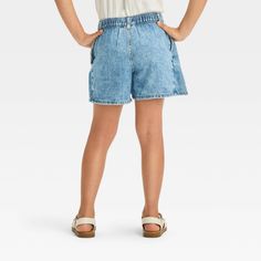 Refresh your child's denim collection for school days, play and beyond with this Pleated Denim Skort from Cat & Jack™. The above-knee skort is fashioned in a classic medium wash with front pleats with mid-rise cut, paired with an adjustable belt-loop waistband with a front snap button and back elastic for a customizable fit. Made from midweight cotton and recycled polyester-cotton blend lining, it boasts built-in shorts for confident wear wherever the day takes them. Handy pockets on the sides c Pleated Denim, Denim Skort, Tennis Skort, Denim Collection, Fabric Tape, Girls Denim, Kids Outfits Girls, Adjustable Belt, Bottom Clothes