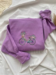 This is a professionally embroidered sweatshirt. 👚MATERIAL 80% cotton 20% polyester ▪️ SIZE  Sizes are unisex. Please check the size chart before you purchase.  💧 CARE:  Machine wash cold, inside-out, gentle cycle with mild detergent and similar colors.   Tumble dry low, or air-dry for longest life. Every item is made to order, creating less fabric waste than conventional manufacturing. Please note that the embroidery comes with a backing that acts as a stabilizer to support the fabric and sti Custom Embroidered Cotton Sweatshirt, Custom Embroidered Cotton Long Sleeve Sweatshirt, Custom Embroidery Cotton Sweatshirt, Custom Embroidery Cotton Long Sleeve Sweatshirt, Custom Embroidered Long Sleeve Cotton Sweatshirt, Purple Fleece Crew Neck Sweatshirt, Purple Cotton Crew Neck Sweatshirt, Embroidered Sweatshirt Outfit, Sweatshirt Aesthetic