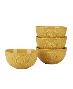 three yellow bowls with bees on them and one bowl has the shape of a bee