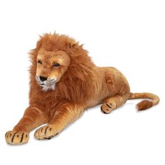 a stuffed lion laying on the ground with it's head turned to the side