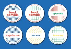 four badges that say eat me, food nomads, surprise me and taste me