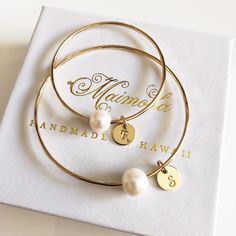 "This lovely bangles is made with 14 ga gold filled, rose gold or sterling silver round wire and creamy white fresh water pearl. Bangle is hand- formed, hammered into a scalloped design and polished for a stunning texture and shine. It looks great worn alone or stack with other shell and charm bangles to create a chic, fun beachy look. Pearl is 8-10mm in sizes. Pearl is the birthstone for June. Each bangle is custom made to order so can not be return or exchange for that reason. I can custom mad Rose Gold Stackable Bangle For Wedding, Stackable Rose Gold Bangle For Wedding, Gold Bangle Bracelet For Wedding Gift, Rose Gold Stackable Bangle As Gift, Dainty Stackable Bangle For Wedding, Rose Gold Bangle For Gift, Minimalist White Bangle For Gift, Bangle Jewelry For Bridesmaid Gift, Dainty Rose Gold Bangle For Gift