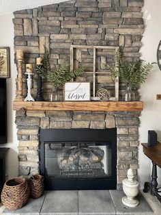 a living room with a stone fireplace and mantle