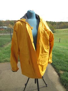 "nice, lined coat with pockets, snaps ,2 high  side pockets and 2 lower pockets misty habor size med bust 24 x2 31\" long  draw sting around waist and on hood" Hooded Yellow Raincoat For Fall, Yellow Hooded Raincoat For Fall, Yellow Raincoat With Pockets For Fall, Yellow Windbreaker With Pockets For Fall, Yellow Raincoat For Fall Outdoor Use, Fall Yellow Windbreaker With Pockets, Yellow Outerwear For Rainy Fall Weather, Yellow Raincoat For Outdoor Use In Fall, Yellow Hooded Raincoat For Winter