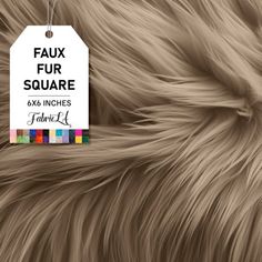 the tag is attached to a furry animal's fur textured with multicolored squares