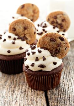 chocolate chip cookies and white frosting on top of cupcakes