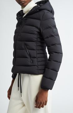 Emblematic of Moncler's Matte Black collection, this channel-quilted puffer jacket is packed with premium down and equipped with plenty of zip pockets. Two-way front-zip closure Fixed hood Vertical chest-zip pocket; front zip pockets Drawcord-toggle hem Lined, with down fill 85% polyamide, 15% elastane Dry clean Imported Designer Clothing Luxury Black Down Puffer Jacket, Black Luxury Quilted Puffer Jacket, Luxury Black Puffer Jacket With Double-lined Hood, Black Luxury Puffer Jacket With Double-lined Hood, Luxury Nylon Puffer Jacket, Luxury Black Quilted Puffer Jacket, Luxury Black Puffer Jacket With Zipper Closure, Luxury Hooded Puffer Jacket With Zipper Closure, Luxury Down Outerwear With Zipper Closure