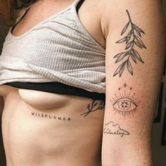 a woman with a tattoo on her left arm and the word wildflower written in cursive ink