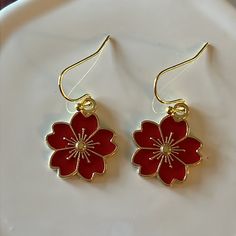 Red Flower Earrings Made With Enamel And Gold Earwire. *Approx 3/4” Flower *Gold Plated Earwire Rose Red Flower Earrings For Pierced Ears, Red Flower Earrings For Valentine's Day, Red Flower Charm Earrings, Red Flower Earrings With Ear Wire, Red Flower Drop Earrings, Rose Red Flower Earrings, Red Dangle Flower Earrings For Valentine's Day, Red Flower Earrings As Gift, Red Flower Earrings For Gift