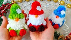 three small knitted christmas gnomes sitting next to each other