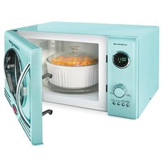 a blue microwave oven with food in it