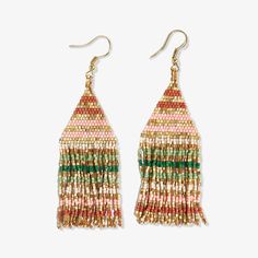 the multicolored fringe earrings are hanging from gold hooks