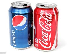 two cans of soda are shown side by side