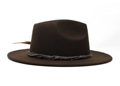 Type: Center Dent Wide Brim Fedora Adjustable Size: With a tie of a knot, adjust the fit of your hat to the ideal size from 21 ¼ to 23 ¼ inches. Dimensions: Wired Brim: 2 7/8", Crown: 4" Color: Brown Materials: 65% Cotton , 35% Polyester Cotton Linen Hat Band Golden Black stripped Pheasant Feather Red Spot Jasper Stone Origin: All of our hats begin in Ecuador as the body is molded, then completed at our studio in Tucson, AZ. Here we shape, trim and handcraft all of the hatbands, leather goods, s Adjustable Wide Brim Top Hat, Adjustable Brown Fedora With Flat Bill, Adjustable Solid Hat Band For Fall, Adjustable Solid Top Hat With Short Brim, Adjustable Casual Solid Hat Band, Casual Solid Adjustable Hat Band, Adjustable Brown Top Hat For Fall, Adjustable Flat Bill Hat Bands For Fall, Casual Adjustable Top Hat With Short Brim