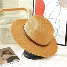 Super Stylish Panama Hat With Leather Band. Mixed Natural Color Casual Brown Straw Hat, Casual Brown Straw Hat For Travel, Casual Brown Straw Sun Hat, Vintage Brown Sun Hat For Vacation, Vintage Brown Hats For Beach, Vintage Brown Travel Hat, Brown Wide Brim Fedora For Day Out, Brown Bucket Straw Hat For Outdoor, Brown Fedora Panama Hat For Day Out