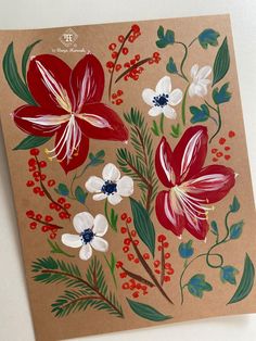 a brown card with red, white and blue flowers on it