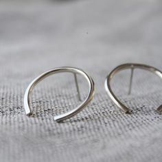 Striking & minimal – these large open circle studs float effortlessly on your earlobes.— d e t a i l s —-arc studs measure roughly 2.5cm tall-hand forged out of solid sterling silver-mirror finish-All Lola&Cash jewellery will arrive in gift giving mode!>>>————��——————<<<>>>——————————<< Minimal Silver Earrings, Minimalist Open Circle Hoop Earrings For Everyday, Minimalist Semi-circle Hoop Earrings As Gift, Minimalist Semi-circle Hoop Earrings For Gift, Minimalist Open Circle Hoop Earrings, Silver Minimalist Hoop Earrings, Cute Ear Piercings, 18k Gold Earrings, Silver Mirror