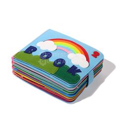 a stack of children's books with rainbows and clouds on them, all in different colors