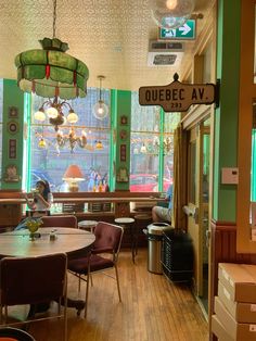 the inside of a restaurant with tables and chairs