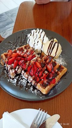 waffles, ice cream and strawberries on a plate