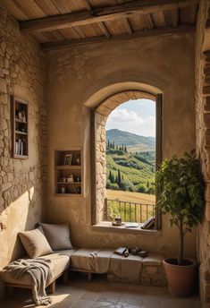 an arched window overlooks the rolling hills and valleys from a stone - walled room