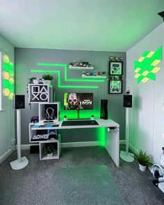 the room is decorated in green and white with neon lights on the wall, along with various electronics