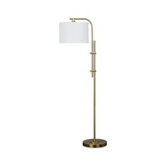 a floor lamp with a white shade on the top and a gold metal base,