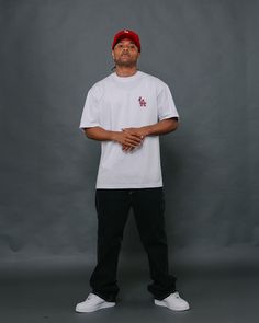 a man standing in front of a gray background