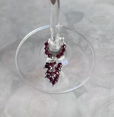 a wine glass with some red beads on it