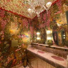 a fancy bathroom decorated in pink and gold