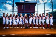 the softball team is posing for a photo