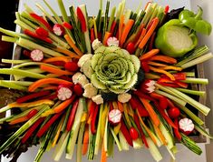 an arrangement of vegetables arranged in the shape of a flower