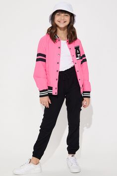 Available In Neon Pink And Black. Varsity Jacket Solid Pockets Button/Snap Front Disclaimer: Due To The Printing Process A Difference In Saturation May Occur. Each Garment Is Unique. 100% Nylon Imported | Mini A Lister Varsity Jacket in Neon Pink size 5/6 by Fashion Nova Sporty Outerwear With Ribbed Cuffs For School, Casual Hooded Varsity Jacket With Button Closure, Trendy Long Sleeve Varsity Jacket With Button Closure, Trendy School Outerwear For Fall, Trendy Fall Outerwear For School, Spring Varsity Outerwear For School, Varsity Outerwear For School In Spring, Spring Varsity Jacket With Button Closure And Long Sleeves, Varsity Style Spring Outerwear For School