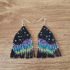 Shimmery Aurora on black background. Ear hooks are stainless steel. Black Fringe Dangle Chandelier Earrings, Black Beaded Fringe Dangle Tassel Earrings, Black Beaded Fringe Tassel Dangle Earrings, Black Beaded Fringe Tassel Drop Earrings, Black Beaded Fringe Earrings As Gift, Black Beaded Fringe Tassel Earrings As Gift, Black Fringe Tassel Drop Earrings, Black Tassel Earrings With Dangling Beads As Gift, Black Fringe Drop Earrings