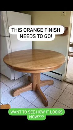 a wooden table sitting in front of a refrigerator