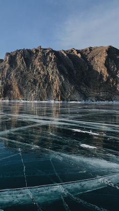 an ice floet with mountains in the background