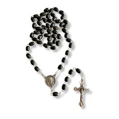 Discover a deeply spiritual treasure with this exquisite Saint Padre Pio black wooden rosary. Crafted with reverence and care, each bead is made from dark, lightweight wood that feels warm and comforting to the touch. The rosary's total length of 19 inches makes it both a substantial and portable item, perfect for prayer and meditation wherever you go. The centerpiece of this rosary is truly unique. It features a beautifully detailed image of Saint Padre Pio on the front, inviting a deep connect Wooden Rosary, Pope Benedict, Pray For Us, Catholic Gifts, Detailed Image, Rosary, Beads