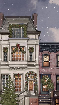 a large white building with christmas wreaths on it's windows and snow falling all around