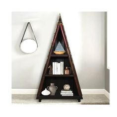 a triangular shelf with books and vases on it