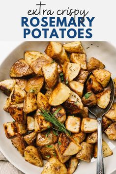 a white bowl filled with potatoes and topped with rosemary garnish next to a spoon