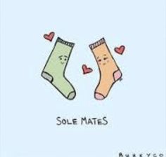 two socks with faces and hearts on them, one saying sole mates while the other says love