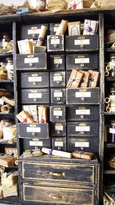 an old wooden cabinet filled with lots of boxes