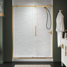 a walk in shower sitting next to a white sink