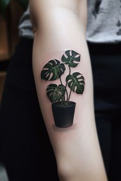 A striking monstera pot plant hand tattoo, showcasing intricate details, subtle shading, and a lovely pot in a vibrant design, radiating a sense of tranquility and growth. This enchanting design embodies the beauty of nature and indoor gardening, making it a fitting choice for those seeking a significant and artistic symbol of their personal growth and connection to nature on their hand. Monstera Pot, Hippie Makeup, Card Tattoo Designs, Gemini Tattoo, Latest Tattoos, Card Tattoo, Face Tattoos, Cover Up Tattoo