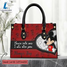 Custom Name I Will Bite You Mickey Mouse Pattern Premium Leather Handbag It’s a practical accessory for fashion-conscious individuals on the go and makes an excellent gift choice for special occasions. The bag is crafted with care and attention to detail, made of high-quality PU leather with a soft microfiber layer that protects your belongings. It features two zippered pockets, one flat pocket, and one detachable pocket, making it ideal for organizing your essentials. The bag is spacious enough Mickey Mouse Pattern, Leather Bag Tag, Custom Leather Bag, Small Hand Bags, Mouse Pattern, Bag Names, Handbag Black, Personalize Bag, Everyday Items