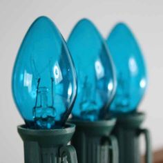 blue light bulbs are lined up in a row