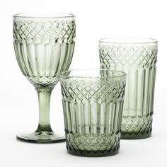 three green glassware sitting next to each other