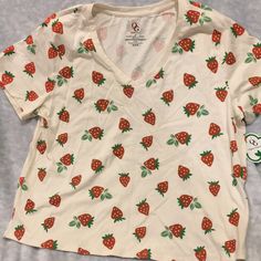 Strawberries Plus Size 2x Tee Shirt By Organic Generation, Made Of %100 Cotton. Nwt Hand Wash Cold Water, Lay Flat To Dry. Vanilla Colored Shirt With Rust Red Berries And Kelly Green Leaves, Berries Design Is On Both Sides Of Shirt. Short Sleeved V Neck. Measures 22.50” Pit To Pit, Hips 24” Across, Length 25.50”. V Neck 9” Across. Nicely Tailored. Cute V-neck Top With Graphic Print, Cute Strawberry Print Tops For Spring, Cute Fruit Print T-shirt, Trendy Red Tops With Strawberry Print, Casual Short Sleeve Tops With Strawberry Print, Casual White Top With Strawberry Print, Red Fruit Print Graphic Tee, Red Graphic Tee With Fruit Print, White Casual Fruit Print Top