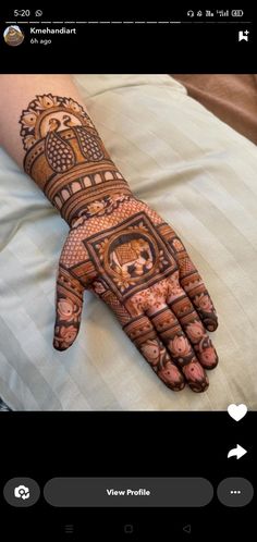 the hand is decorated with intricate designs